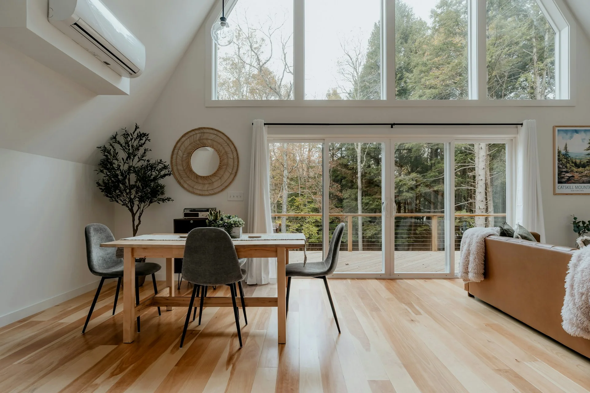 Open living and dining room with light oak flooring