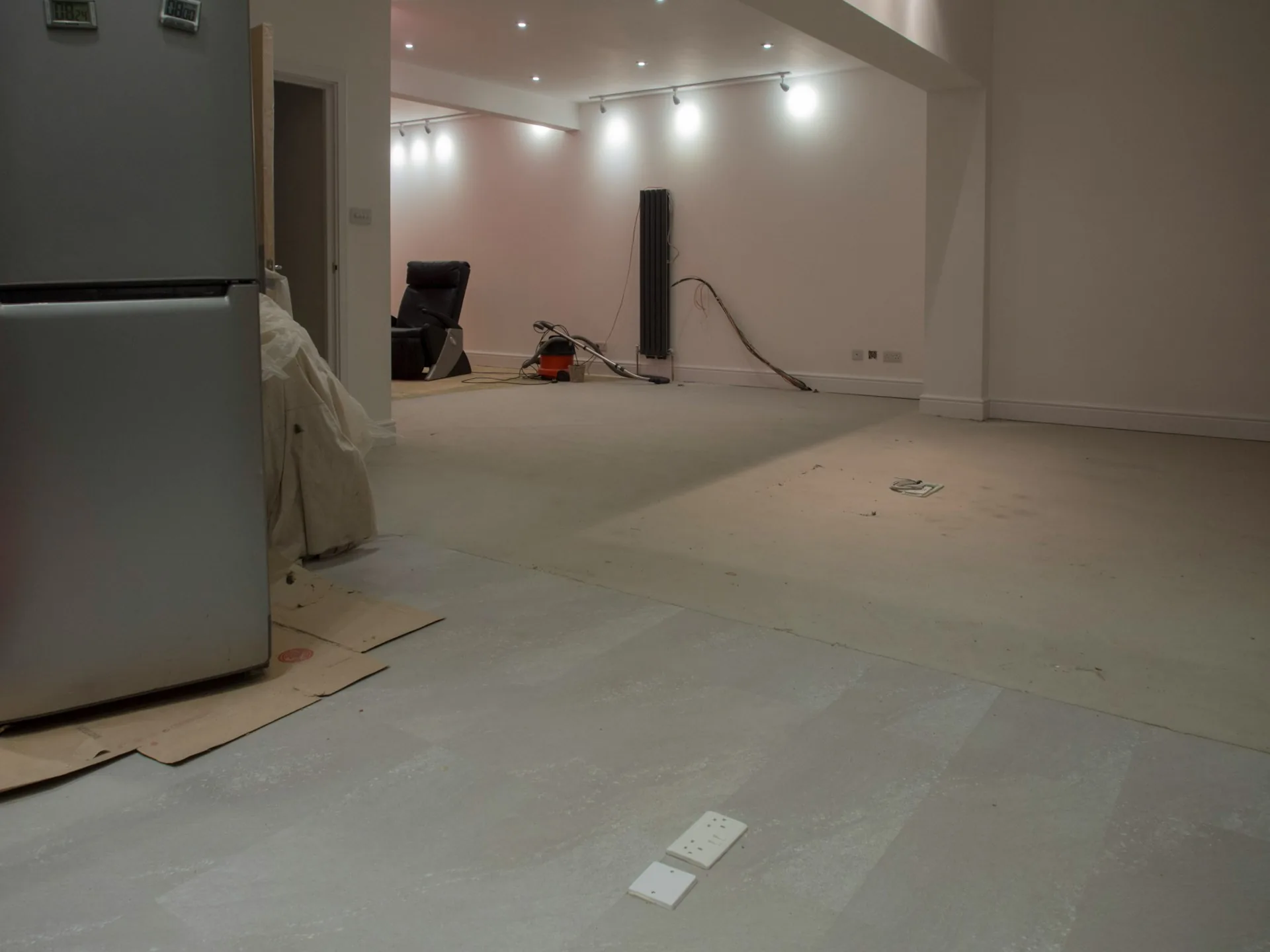 Room under renovation with the floor protected before new flooring