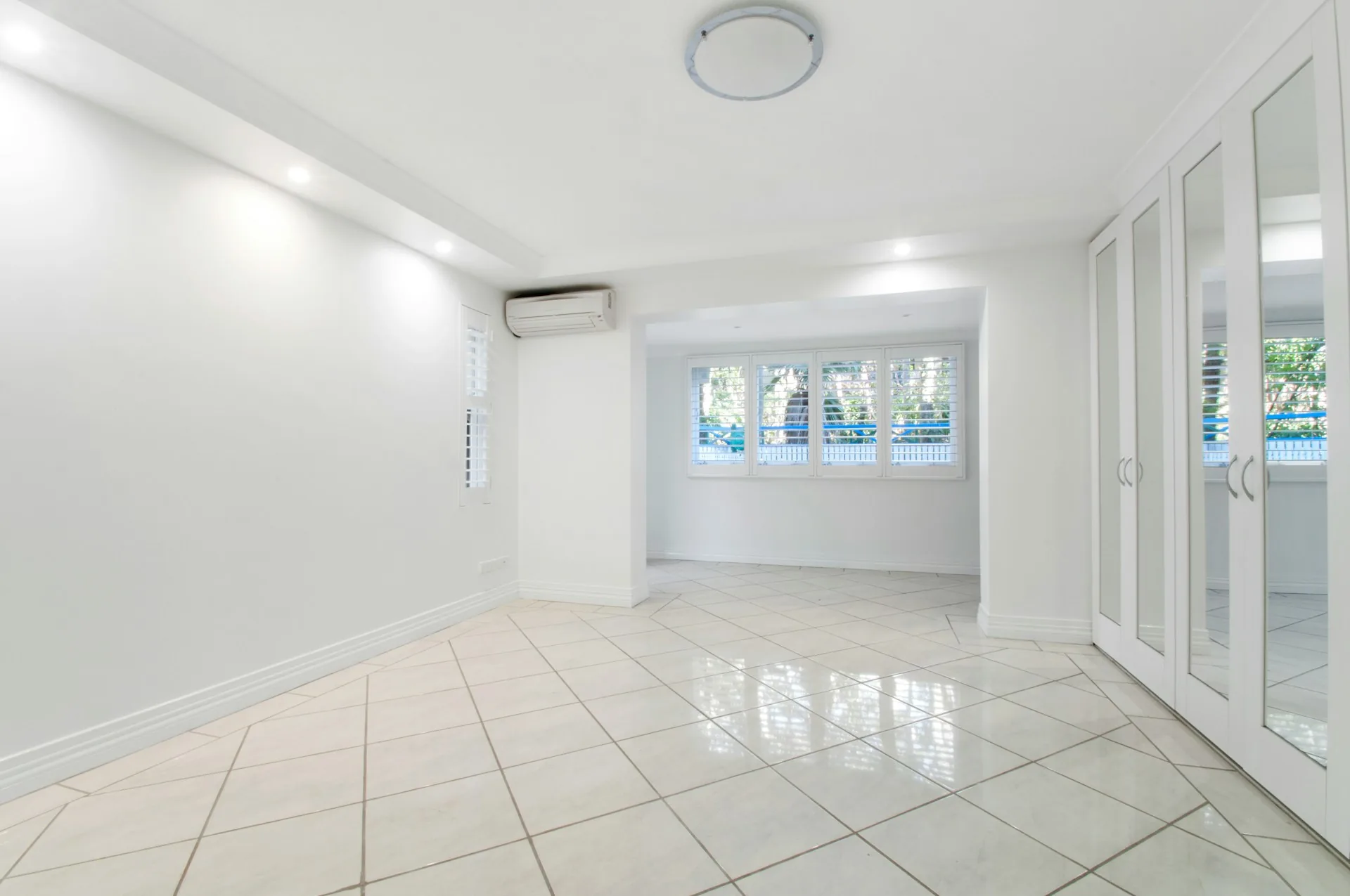 Bright room with a glossy light tile floor